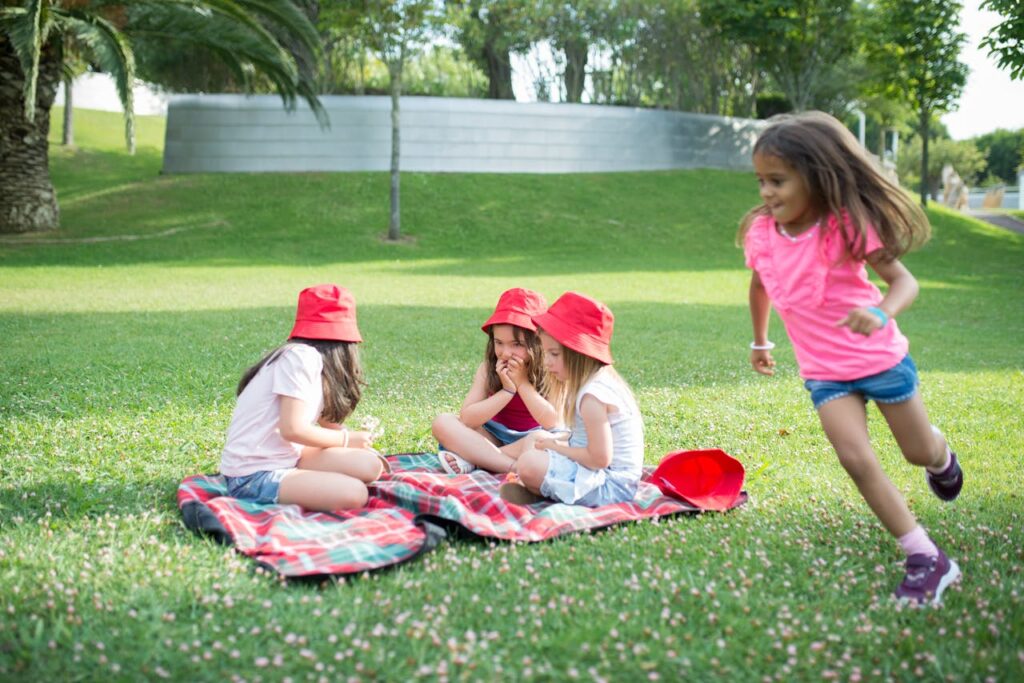girls-sitting-on-green-grass-field-8954786 Girls Sitting on Green Grass Field